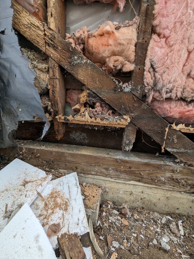 Damaged wall framing exposed during repair